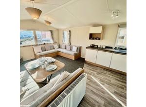 2 bedroom 8 berth used preowned static caravan for sale in Clacton on Sea Essex free 2024 site fees view today pet friendly private parking decking av