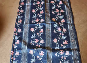 PAIR OF DARK BLUE FLOWERED PATTERNED CURTAINS