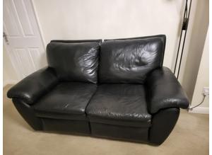 Two seater leather reclining sofa