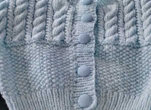 Knitted blue baby jacket