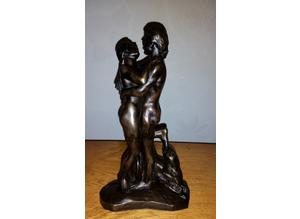 Vintage cold cast bronze of naked lovers entwined.