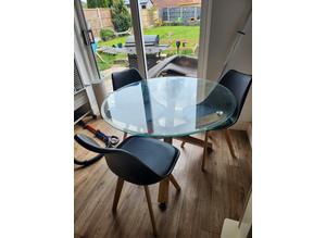 Solid oak and glass dining table and chairs