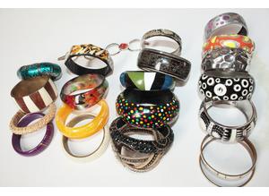Women's 23 Assorted Bangles. Made of assorted materials.