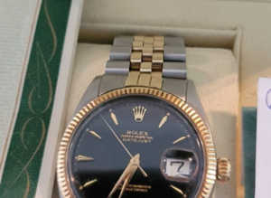 Datejust 1601 Mens 2 Tone Yellow Stainless Steel Watch with Black Dial Rolex This watch is guaranteed vintage