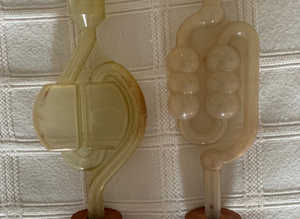 Two plastic bubbler airlocks and 2 bored rubber bungs for glass demijohns.