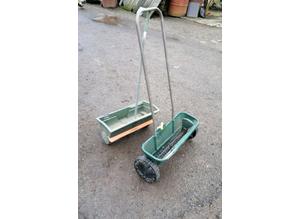 Lawn seed spreaders