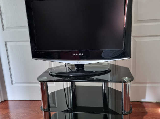 Black glass and chrome 2024 tv stand